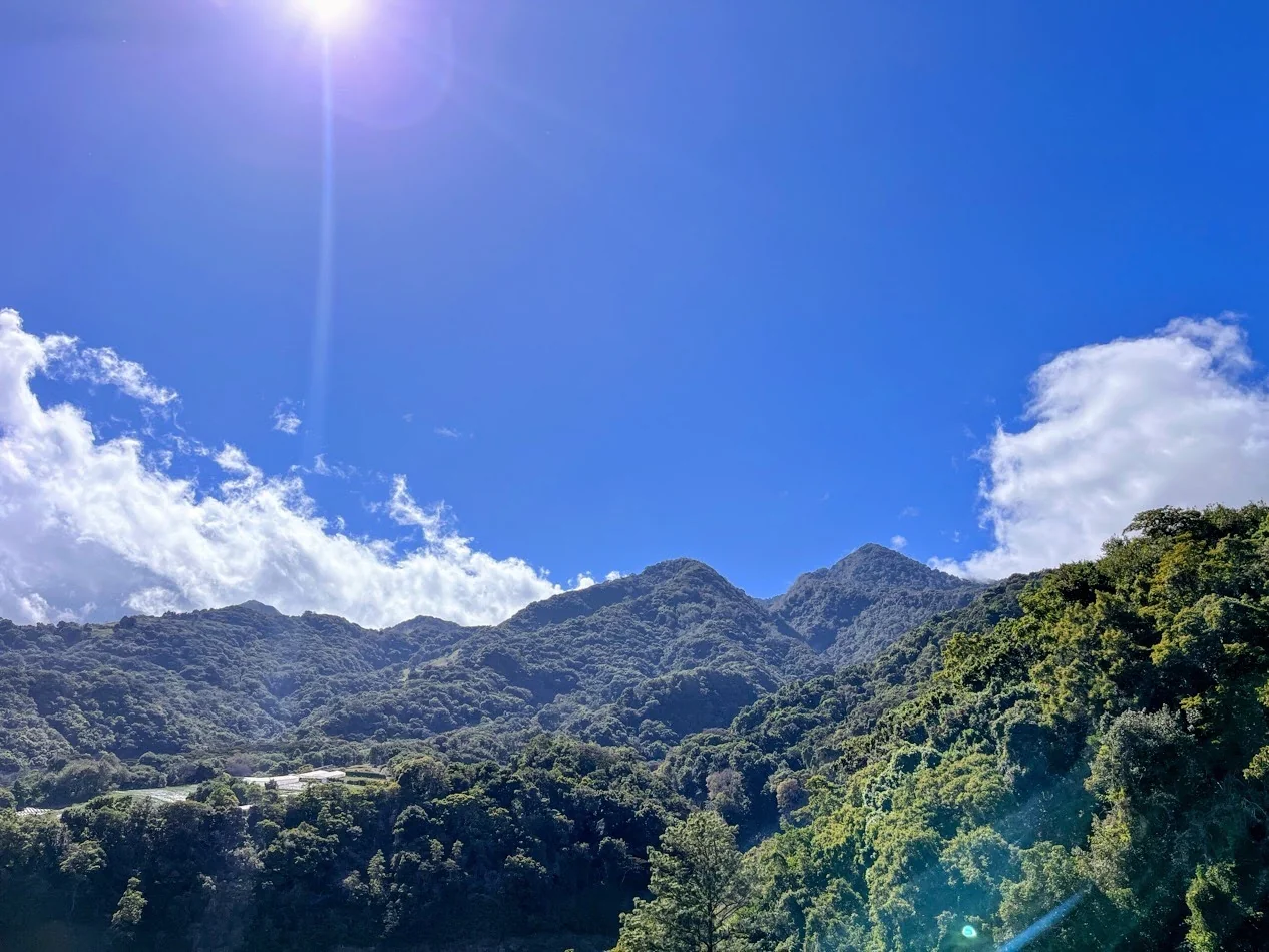 Sunlight and clouds above the green mountains of Boquete, Panama